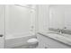 Clean bathroom with tile shower-tub combination, granite vanity, and coordinated fixtures at 1878 Draughton Dr, Zephyrhills, FL 33541