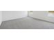 Bright bedroom features neutral walls, plush carpeting, and windows offering serene views at 1878 Draughton Dr, Zephyrhills, FL 33541