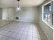 Living room features tile floors and a window at 3213 Bigelow Dr, Holiday, FL 34691