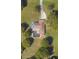 Aerial view of home with a private pool and expansive, well-manicured yard at 3652 Oak Grove Dr, Sarasota, FL 34243