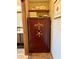 Bathroom featuring a large gun safe and wood shelving, next to a vanity at 3652 Oak Grove Dr, Sarasota, FL 34243