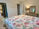 This bedroom offers a quaint vanity, tiled flooring, and access to an en suite bathroom at 3652 Oak Grove Dr, Sarasota, FL 34243