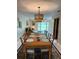 Traditional dining room with seating for eight, open floorplan and natural light at 3652 Oak Grove Dr, Sarasota, FL 34243