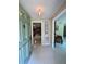 Inviting foyer with a stylish front door and views into the living spaces at 3652 Oak Grove Dr, Sarasota, FL 34243