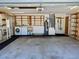 Garage includes laundry units, wash sink, storage, and water heater at 3652 Oak Grove Dr, Sarasota, FL 34243