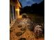 Scenic walkway with stone steps and garden lighting, leading to a lush, landscaped yard at 3652 Oak Grove Dr, Sarasota, FL 34243