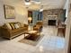 Spacious living room featuring a stone fireplace, neutral tones, and comfortable furnishings at 3652 Oak Grove Dr, Sarasota, FL 34243