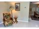Bright living room featuring tile floors, chair, and tropical decor at 3652 Oak Grove Dr, Sarasota, FL 34243