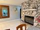 Living room featuring a stone fireplace and elegant decor at 3652 Oak Grove Dr, Sarasota, FL 34243