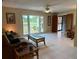 Bright living room with tiled flooring and view of the landscaped front yard at 3652 Oak Grove Dr, Sarasota, FL 34243