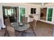 Enclosed patio with outdoor seating and ceiling fan offers a relaxing extension of the home at 3652 Oak Grove Dr, Sarasota, FL 34243