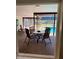 Covered patio seating area overlooking the pool and landscaped backyard at 3652 Oak Grove Dr, Sarasota, FL 34243