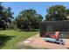Relaxing pool area with colorful lounge chairs and a screened-in patio at 3652 Oak Grove Dr, Sarasota, FL 34243