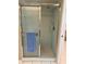 A shower with glass doors, tiled flooring and walls, plus shower head at 3652 Oak Grove Dr, Sarasota, FL 34243