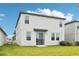 Two-story home with a well-maintained lawn, sliding glass door, and modern exterior design at 2320 E Newsome Rd, Plant City, FL 33565