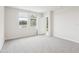 Bright bedroom with neutral carpet, large windows, and lake views at 2320 E Newsome Rd, Plant City, FL 33565