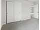 Bedroom featuring neutral paint, carpet flooring, large closet, and a door leading to the hallway at 2320 E Newsome Rd, Plant City, FL 33565