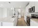 Modern kitchen features stainless steel appliances, granite counters, and white cabinets at 2320 E Newsome Rd, Plant City, FL 33565