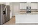Modern kitchen features white cabinets, stainless steel appliances, and an island at 2320 E Newsome Rd, Plant City, FL 33565