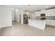 Spacious open concept living area that leads into a kitchen with stainless appliances at 2320 E Newsome Rd, Plant City, FL 33565