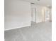 Open concept living area with neutral paint, plush carpeting and views into the hallway at 2320 E Newsome Rd, Plant City, FL 33565