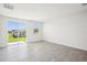 Living room with tile flooring, slider doors, and lots of natural light at 3826 Radiant Mountain Dr, Plant City, FL 33565