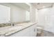 Well-lit bathroom featuring a double sink vanity with granite counters and a shower-tub combination at 3904 Radiant Mountain Dr, Plant City, FL 33565