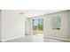 Bright bedroom featuring a sliding glass door and neutral paint, creating a serene atmosphere at 3904 Radiant Mountain Dr, Plant City, FL 33565