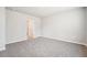 Spacious bedroom featuring neutral walls, carpet flooring, and a doorway to a walk-in closet at 3904 Radiant Mountain Dr, Plant City, FL 33565