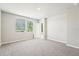 Inviting bedroom with large windows, neutral walls, plush carpeting, and ample natural light at 3904 Radiant Mountain Dr, Plant City, FL 33565