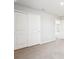 Spacious carpeted bedroom with neutral walls and closet, offering comfort and storage at 3904 Radiant Mountain Dr, Plant City, FL 33565