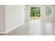 Bright bedroom featuring tile floors, large window with a view to the back yard at 3904 Radiant Mountain Dr, Plant City, FL 33565