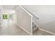 Spacious foyer with tile flooring, staircase, and view into the open-concept living area at 3904 Radiant Mountain Dr, Plant City, FL 33565