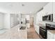 Modern kitchen featuring stainless steel appliances and a granite countertop island at 3904 Radiant Mountain Dr, Plant City, FL 33565