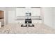 Spacious kitchen island and stainless steel sink against a backdrop of white cabinets at 3904 Radiant Mountain Dr, Plant City, FL 33565