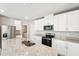 Modern kitchen featuring stainless steel appliances and a granite countertop island at 3904 Radiant Mountain Dr, Plant City, FL 33565
