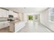 Kitchen with granite countertops, island, stainless steel appliances, and sliding glass door at 3904 Radiant Mountain Dr, Plant City, FL 33565