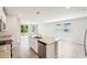 Kitchen island features a stainless-steel dishwasher, sink, and granite countertops at 3904 Radiant Mountain Dr, Plant City, FL 33565
