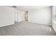 Spacious living room featuring carpet flooring, neutral walls, and ample natural light at 3904 Radiant Mountain Dr, Plant City, FL 33565