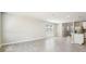 Bright living room featuring tiled flooring and a view into the kitchen at 3904 Radiant Mountain Dr, Plant City, FL 33565