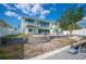 Home with a spiral staircase, steps down to the boat canal at 8704 Bay Crest Ln, Tampa, FL 33615
