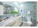 Bright bathroom featuring a double vanity, marble countertop, and modern fixtures at 8704 Bay Crest Ln, Tampa, FL 33615