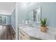 Bathroom with vanity and vessel sink, complimented by wood-look floors at 8704 Bay Crest Ln, Tampa, FL 33615