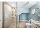 Modern bathroom features a tiled walk-in shower and a neutral vanity at 8704 Bay Crest Ln, Tampa, FL 33615