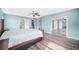 Large main bedroom featuring stylish floors and access to a walk in closet at 8704 Bay Crest Ln, Tampa, FL 33615