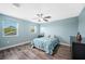 Bedroom with wood floors and natural light at 8704 Bay Crest Ln, Tampa, FL 33615