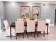 Classic dining room featuring seating for six with modern lighting and tiled flooring at 8704 Bay Crest Ln, Tampa, FL 33615