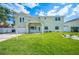 Charming two-story home with a well-manicured lawn and inviting front entrance at 8704 Bay Crest Ln, Tampa, FL 33615