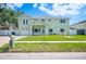 Charming two-story home with a well-manicured lawn and inviting front entrance at 8704 Bay Crest Ln, Tampa, FL 33615