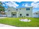 Charming two-story home with a well-manicured lawn and inviting front entrance at 8704 Bay Crest Ln, Tampa, FL 33615